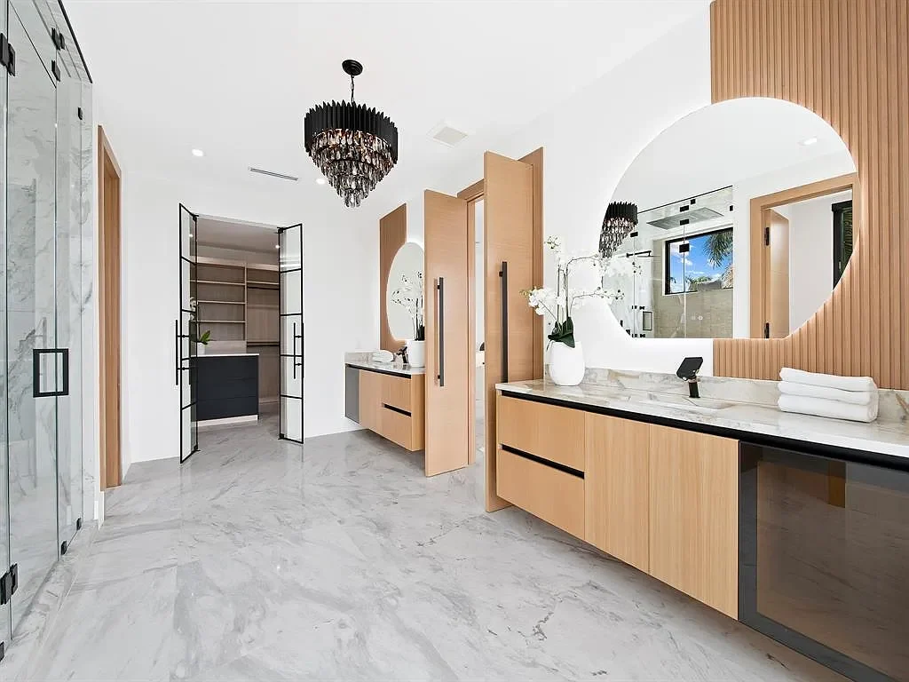 Stunning $10.2 Million New Construction Waterfront Mansion in Fort Lauderdale Hits the Market 13 Luxury waterfront home at 111 Fiesta Way in Fort Lauderdale with canal frontage, pool, and modern three-story architecture.