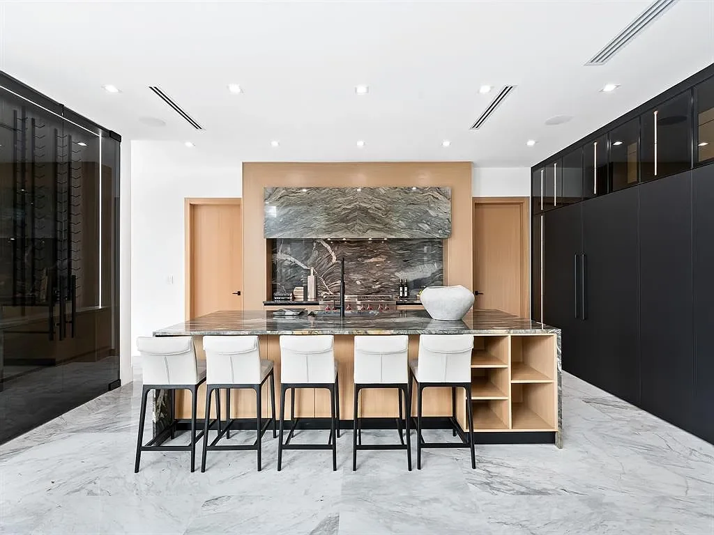 Stunning $10.2 Million New Construction Waterfront Mansion in Fort Lauderdale Hits the Market 9 Luxury waterfront home at 111 Fiesta Way in Fort Lauderdale with canal frontage, pool, and modern three-story architecture.