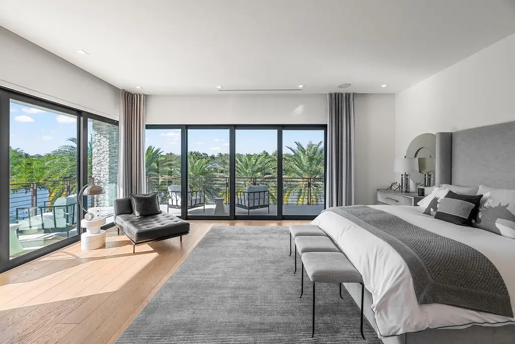 $10.9 Million Waterfront Estate in Wellington Showcases Luxury Living in Palm Beach Polo Community 12 Luxury waterfront estate in Wellington Florida featuring modern architecture, private pool, and scenic pond views in Palm Beach Polo community