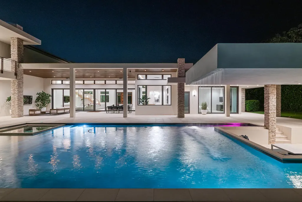 $10.9 Million Waterfront Estate in Wellington Showcases Luxury Living in Palm Beach Polo Community 15 Luxury waterfront estate in Wellington Florida featuring modern architecture, private pool, and scenic pond views in Palm Beach Polo community