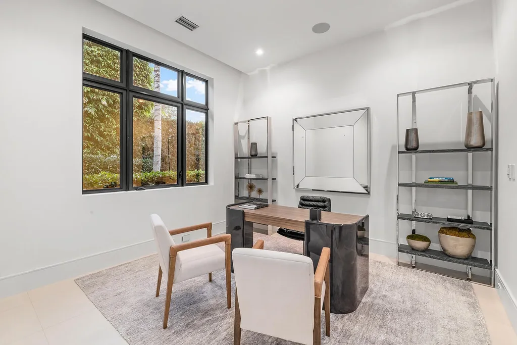 $10.9 Million Waterfront Estate in Wellington Showcases Luxury Living in Palm Beach Polo Community 11 Luxury waterfront estate in Wellington Florida featuring modern architecture, private pool, and scenic pond views in Palm Beach Polo community