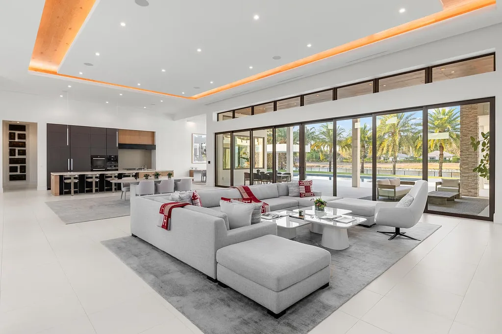 $10.9 Million Waterfront Estate in Wellington Showcases Luxury Living in Palm Beach Polo Community 6 Luxury waterfront estate in Wellington Florida featuring modern architecture, private pool, and scenic pond views in Palm Beach Polo community