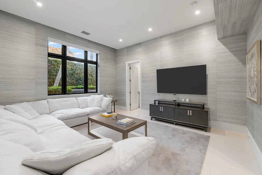 $10.9 Million Waterfront Estate in Wellington Showcases Luxury Living in Palm Beach Polo Community 14 Luxury waterfront estate in Wellington Florida featuring modern architecture, private pool, and scenic pond views in Palm Beach Polo community