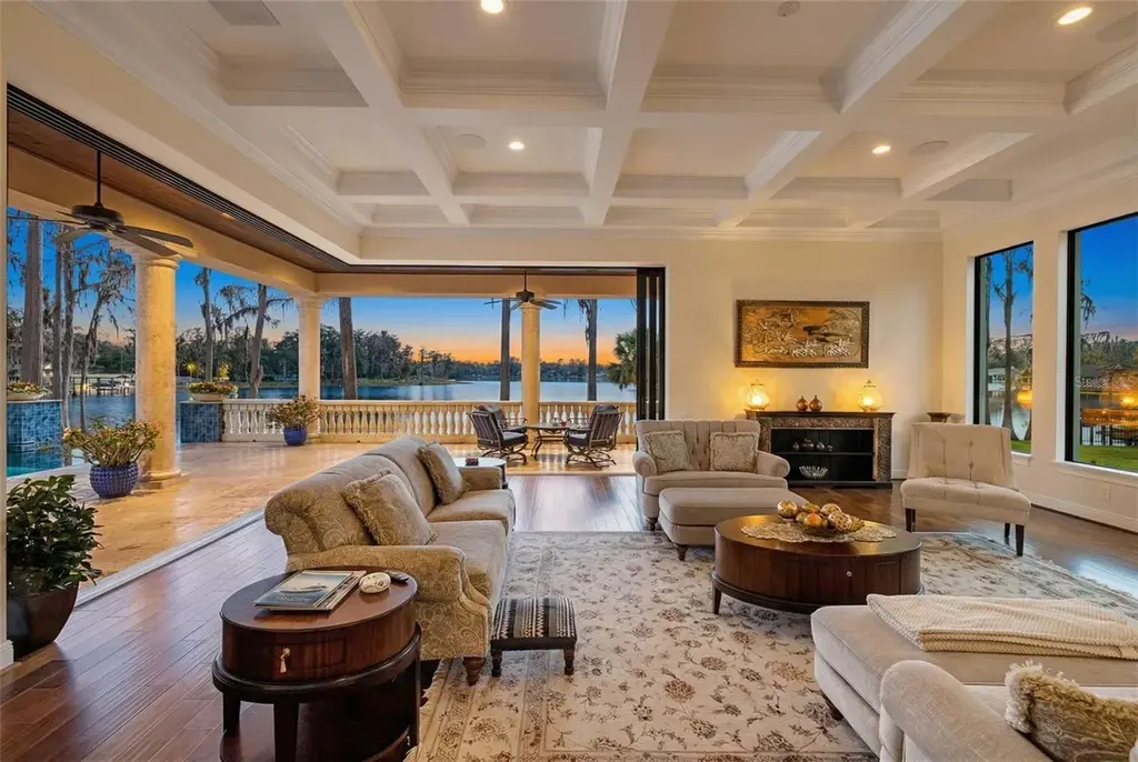 $6 Million Lakefront Mediterranean Estate Elevates Luxury Living in Odessa with Nearly Six Private Acres 6 Front elevation of 17124 Crawley Rd showcasing gated entrance and expansive estate grounds in Odessa Real Estate