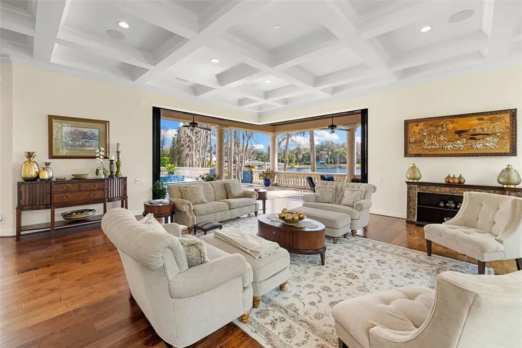 $6 Million Lakefront Mediterranean Estate Elevates Luxury Living in Odessa with Nearly Six Private Acres 13 Front elevation of 17124 Crawley Rd showcasing gated entrance and expansive estate grounds in Odessa Real Estate