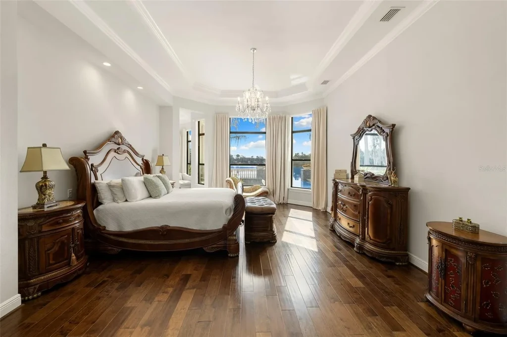 $6 Million Lakefront Mediterranean Estate Elevates Luxury Living in Odessa with Nearly Six Private Acres 15 Front elevation of 17124 Crawley Rd showcasing gated entrance and expansive estate grounds in Odessa Real Estate