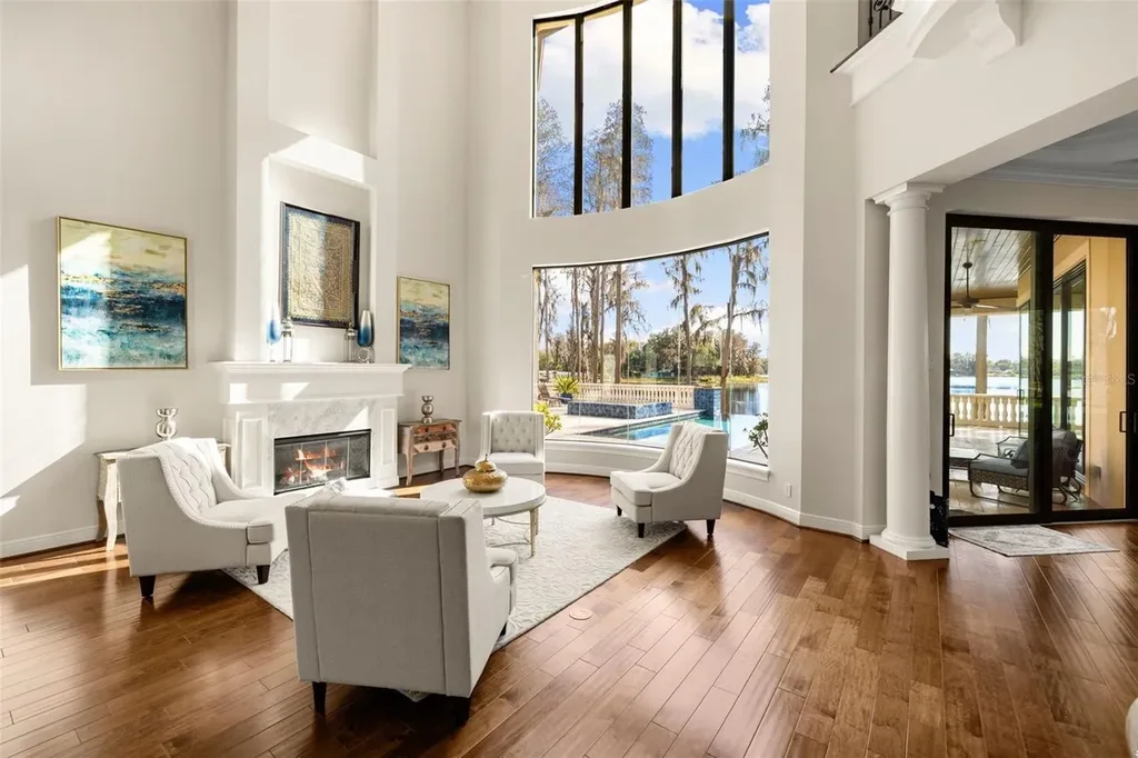 $6 Million Lakefront Mediterranean Estate Elevates Luxury Living in Odessa with Nearly Six Private Acres 7 Front elevation of 17124 Crawley Rd showcasing gated entrance and expansive estate grounds in Odessa Real Estate