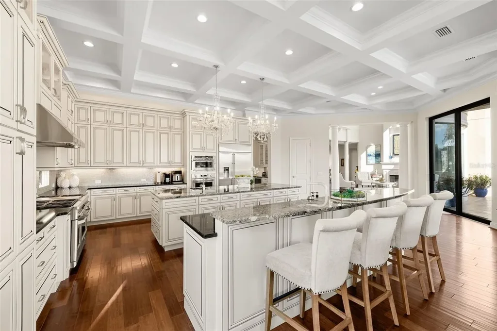 $6 Million Lakefront Mediterranean Estate Elevates Luxury Living in Odessa with Nearly Six Private Acres 10 Front elevation of 17124 Crawley Rd showcasing gated entrance and expansive estate grounds in Odessa Real Estate