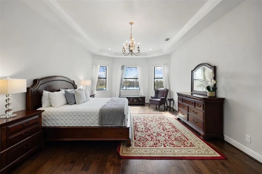 $6 Million Lakefront Mediterranean Estate Elevates Luxury Living in Odessa with Nearly Six Private Acres 14 Front elevation of 17124 Crawley Rd showcasing gated entrance and expansive estate grounds in Odessa Real Estate