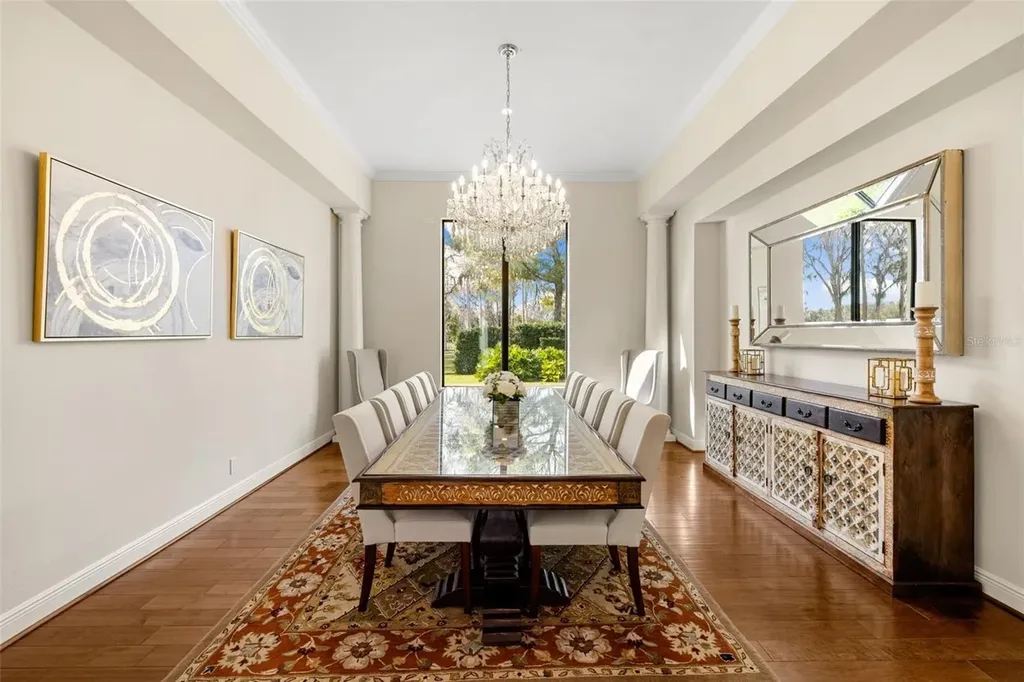 $6 Million Lakefront Mediterranean Estate Elevates Luxury Living in Odessa with Nearly Six Private Acres 11 Front elevation of 17124 Crawley Rd showcasing gated entrance and expansive estate grounds in Odessa Real Estate