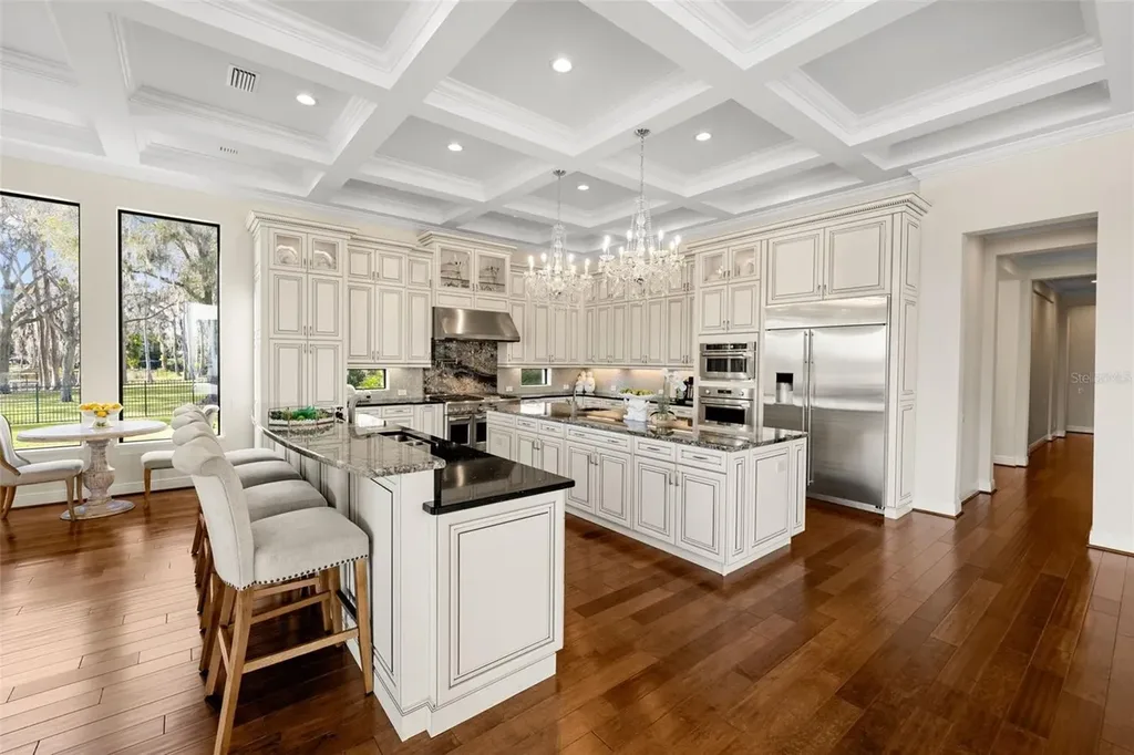 $6 Million Lakefront Mediterranean Estate Elevates Luxury Living in Odessa with Nearly Six Private Acres 9 Front elevation of 17124 Crawley Rd showcasing gated entrance and expansive estate grounds in Odessa Real Estate