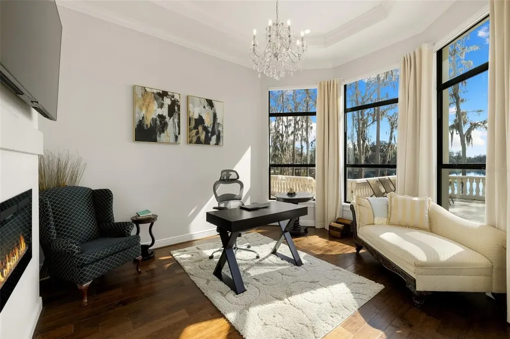 $6 Million Lakefront Mediterranean Estate Elevates Luxury Living in Odessa with Nearly Six Private Acres 12 Front elevation of 17124 Crawley Rd showcasing gated entrance and expansive estate grounds in Odessa Real Estate