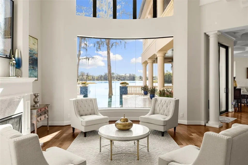 $6 Million Lakefront Mediterranean Estate Elevates Luxury Living in Odessa with Nearly Six Private Acres 8 Front elevation of 17124 Crawley Rd showcasing gated entrance and expansive estate grounds in Odessa Real Estate