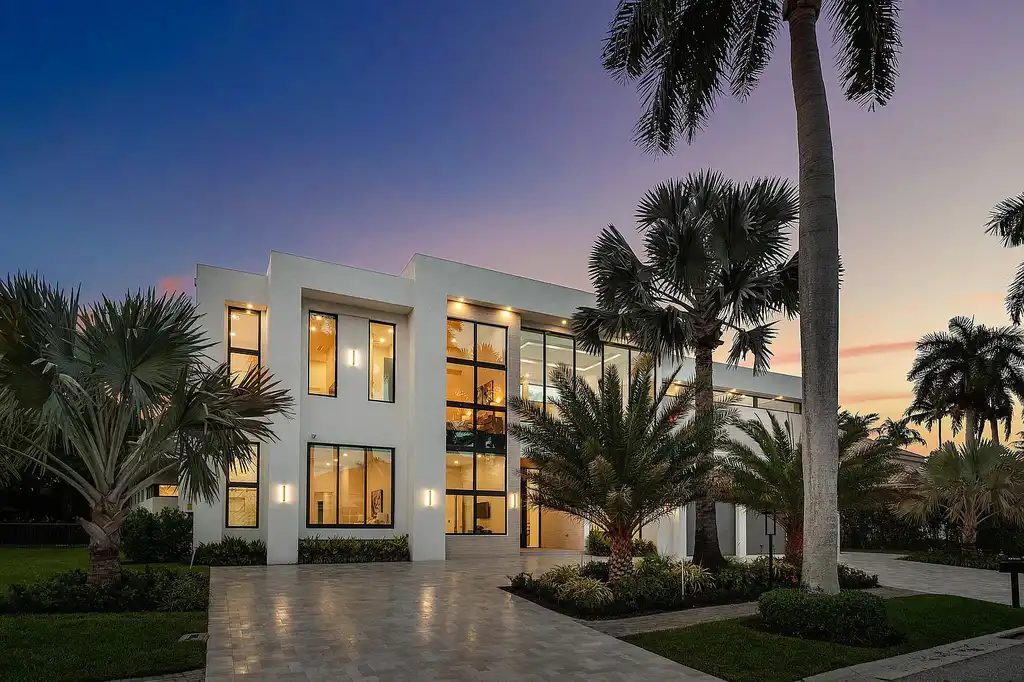 A $12.5 Million Contemporary Estate Redefines Luxury Living in Boca Raton’s Prestigious St Andrews Country Club 5 Modern luxury home at 17699 Lake Estates Drive in Boca Raton featuring a resort-style pool, expansive glass architecture, and contemporary design in St Andrews Country Club