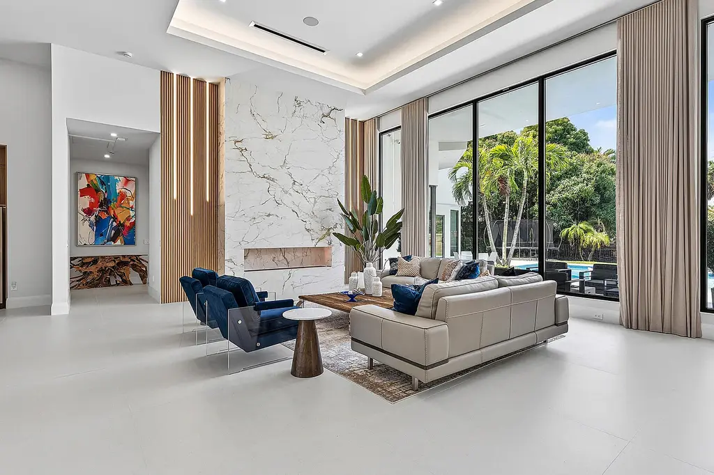 A $12.5 Million Contemporary Estate Redefines Luxury Living in Boca Raton’s Prestigious St Andrews Country Club 8 Modern luxury home at 17699 Lake Estates Drive in Boca Raton featuring a resort-style pool, expansive glass architecture, and contemporary design in St Andrews Country Club