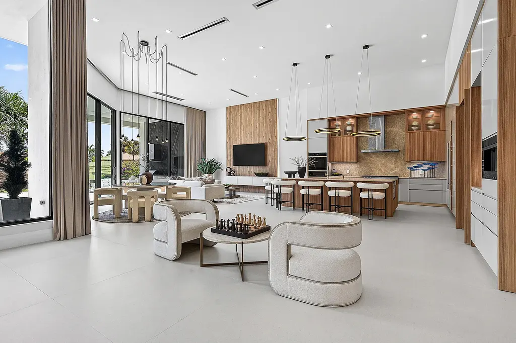 A $12.5 Million Contemporary Estate Redefines Luxury Living in Boca Raton’s Prestigious St Andrews Country Club 11 Modern luxury home at 17699 Lake Estates Drive in Boca Raton featuring a resort-style pool, expansive glass architecture, and contemporary design in St Andrews Country Club