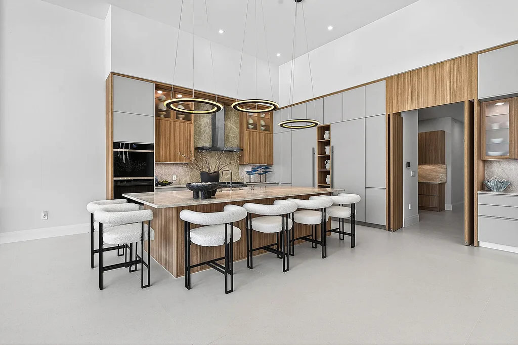 A $12.5 Million Contemporary Estate Redefines Luxury Living in Boca Raton’s Prestigious St Andrews Country Club 12 Modern luxury home at 17699 Lake Estates Drive in Boca Raton featuring a resort-style pool, expansive glass architecture, and contemporary design in St Andrews Country Club