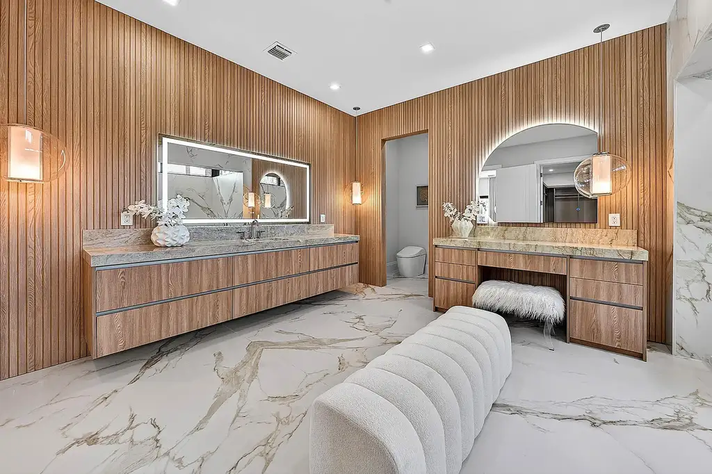 A $12.5 Million Contemporary Estate Redefines Luxury Living in Boca Raton’s Prestigious St Andrews Country Club 15 Modern luxury home at 17699 Lake Estates Drive in Boca Raton featuring a resort-style pool, expansive glass architecture, and contemporary design in St Andrews Country Club