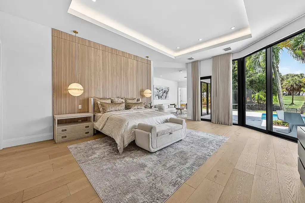 A $12.5 Million Contemporary Estate Redefines Luxury Living in Boca Raton’s Prestigious St Andrews Country Club 14 Modern luxury home at 17699 Lake Estates Drive in Boca Raton featuring a resort-style pool, expansive glass architecture, and contemporary design in St Andrews Country Club