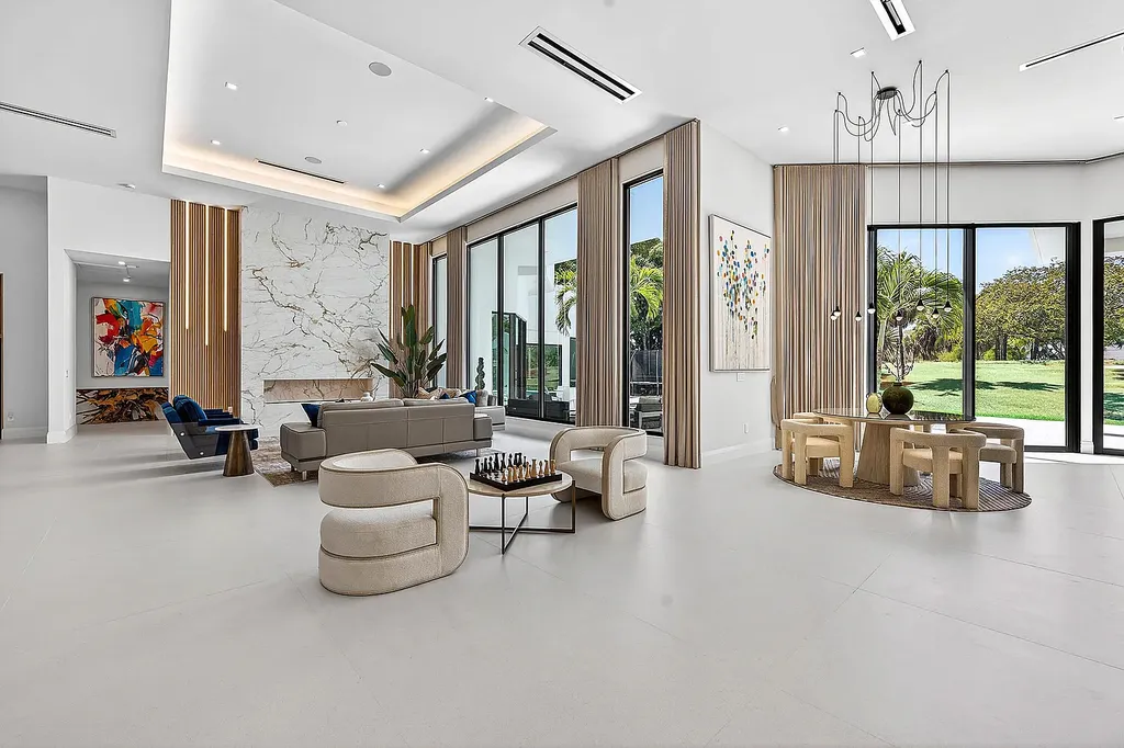 A $12.5 Million Contemporary Estate Redefines Luxury Living in Boca Raton’s Prestigious St Andrews Country Club 9 Modern luxury home at 17699 Lake Estates Drive in Boca Raton featuring a resort-style pool, expansive glass architecture, and contemporary design in St Andrews Country Club