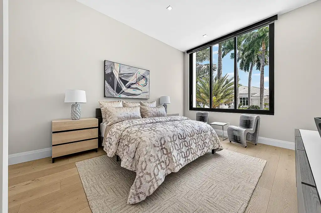 A $12.5 Million Contemporary Estate Redefines Luxury Living in Boca Raton’s Prestigious St Andrews Country Club 16 Modern luxury home at 17699 Lake Estates Drive in Boca Raton featuring a resort-style pool, expansive glass architecture, and contemporary design in St Andrews Country Club