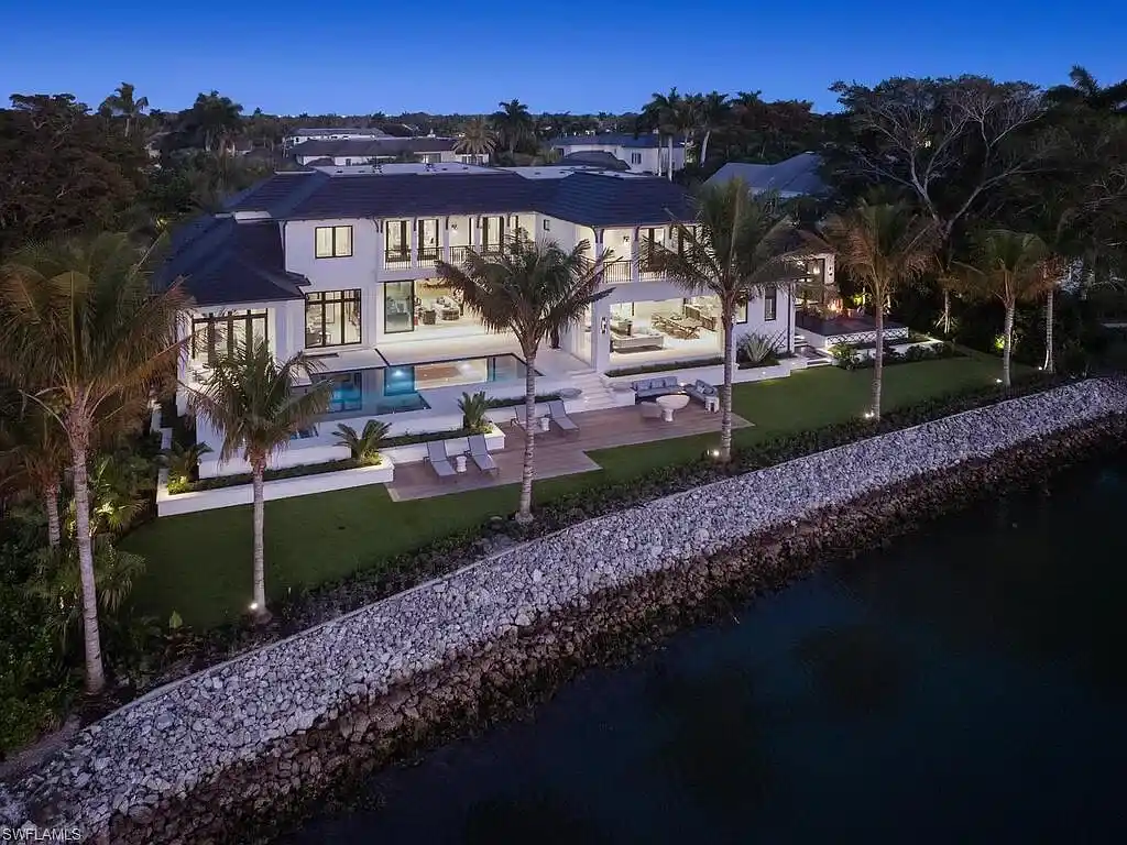$44 Million Iconic Gulf-Access Estate in Port Royal Showcases the Pinnacle of Naples Luxury Living 5 3220 Rum Row luxury waterfront estate in Port Royal Naples featuring modern coastal architecture and lush tropical landscaping