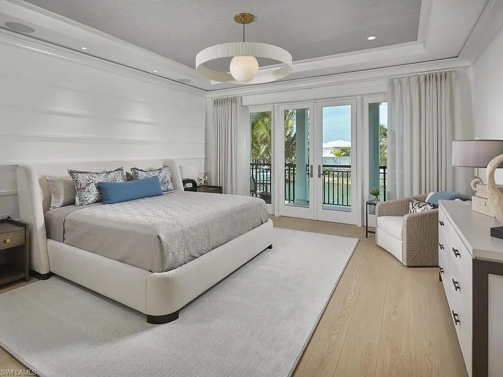 $44 Million Iconic Gulf-Access Estate in Port Royal Showcases the Pinnacle of Naples Luxury Living 13 3220 Rum Row luxury waterfront estate in Port Royal Naples featuring modern coastal architecture and lush tropical landscaping