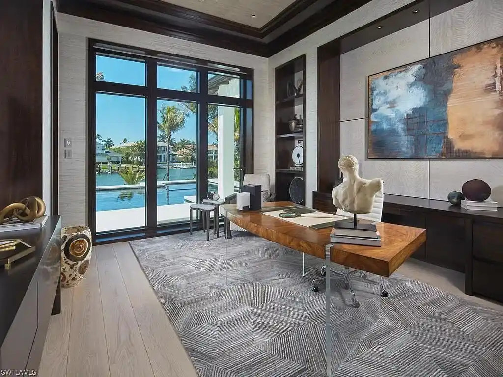 $44 Million Iconic Gulf-Access Estate in Port Royal Showcases the Pinnacle of Naples Luxury Living 16 3220 Rum Row luxury waterfront estate in Port Royal Naples featuring modern coastal architecture and lush tropical landscaping