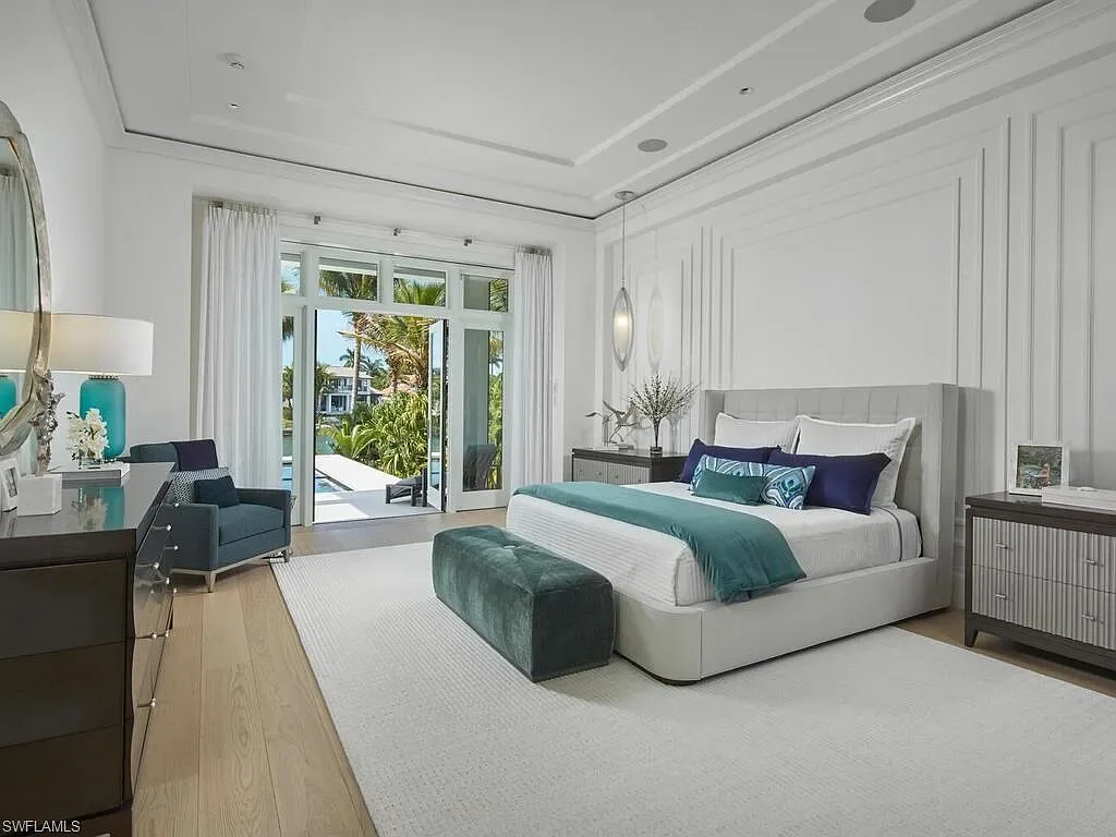 $44 Million Iconic Gulf-Access Estate in Port Royal Showcases the Pinnacle of Naples Luxury Living 14 3220 Rum Row luxury waterfront estate in Port Royal Naples featuring modern coastal architecture and lush tropical landscaping