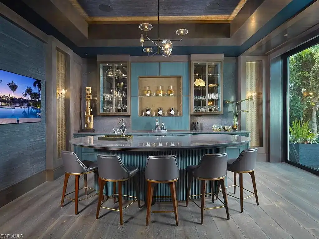 $44 Million Iconic Gulf-Access Estate in Port Royal Showcases the Pinnacle of Naples Luxury Living 8 3220 Rum Row luxury waterfront estate in Port Royal Naples featuring modern coastal architecture and lush tropical landscaping