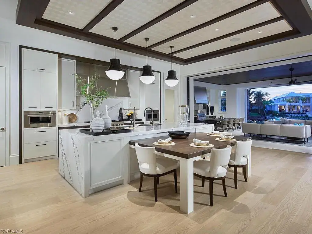 $44 Million Iconic Gulf-Access Estate in Port Royal Showcases the Pinnacle of Naples Luxury Living 11 3220 Rum Row luxury waterfront estate in Port Royal Naples featuring modern coastal architecture and lush tropical landscaping