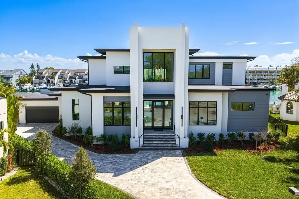 $8.95M Spectacular Waterfront Estate in Saint Petersburg Showcasing Ultimate Gulf-Access Luxury Living 5 Luxury waterfront exterior of 500 Barcelona Dr, a premier home in Saint Petersburg for sale with private dock
