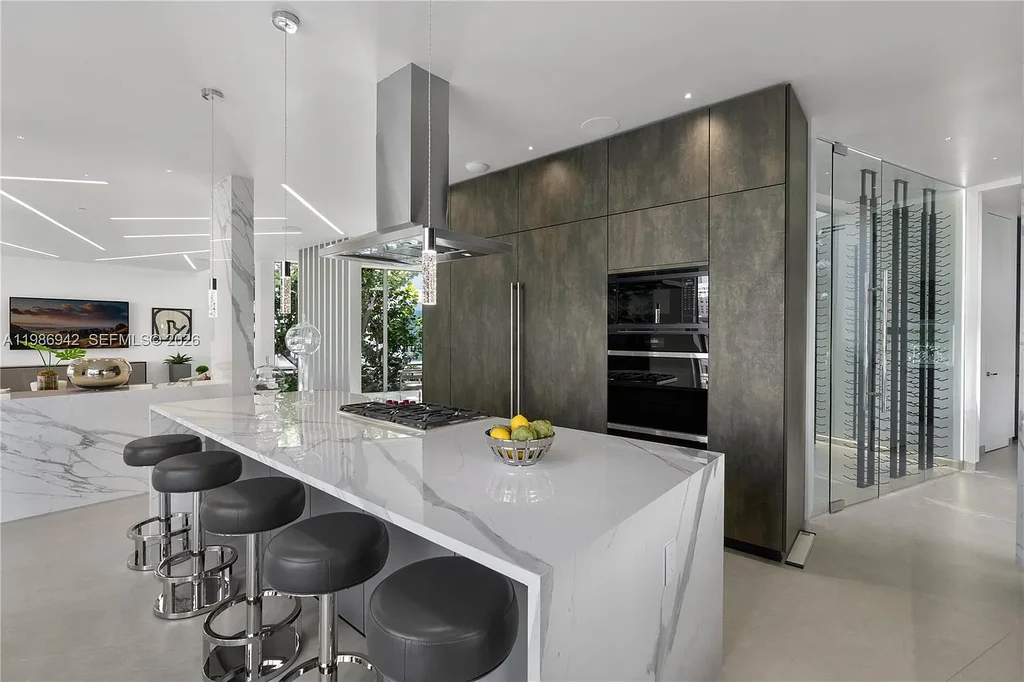 $13 Million Breathtaking Waterfront Estate in Hallandale Beach with 315 Feet Frontage and Private Mega Yacht Dock 10 Modern waterfront estate at 501 Palm Dr in Hallandale Beach with infinity pool, private dock, and Intracoastal views