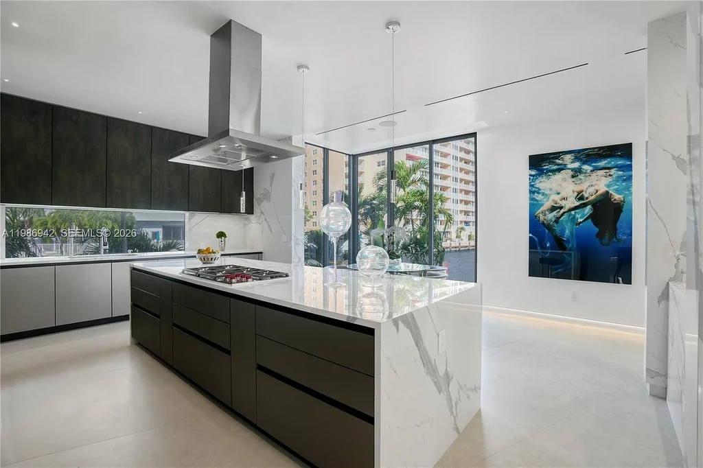 $13 Million Breathtaking Waterfront Estate in Hallandale Beach with 315 Feet Frontage and Private Mega Yacht Dock 11 Modern waterfront estate at 501 Palm Dr in Hallandale Beach with infinity pool, private dock, and Intracoastal views