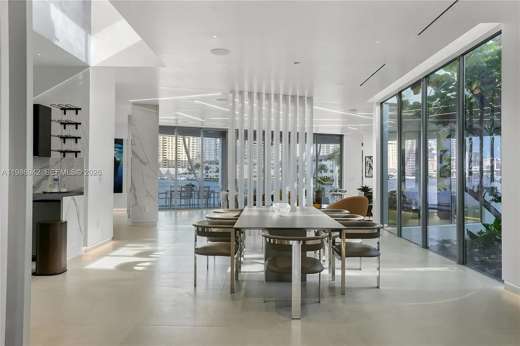 $13 Million Breathtaking Waterfront Estate in Hallandale Beach with 315 Feet Frontage and Private Mega Yacht Dock 9 Modern waterfront estate at 501 Palm Dr in Hallandale Beach with infinity pool, private dock, and Intracoastal views