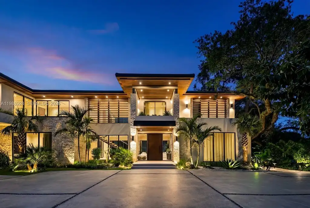 A $22 Million Tropical Modern Estate Brings Resort-Style Living to Miami’s Prestigious Ponce Davis 5 Luxury tropical modern estate in Miami with private tennis court, pool, and expansive outdoor living spaces at sunset