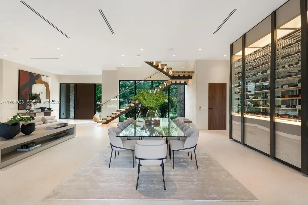 A $22 Million Tropical Modern Estate Brings Resort-Style Living to Miami’s Prestigious Ponce Davis 11 Luxury tropical modern estate in Miami with private tennis court, pool, and expansive outdoor living spaces at sunset