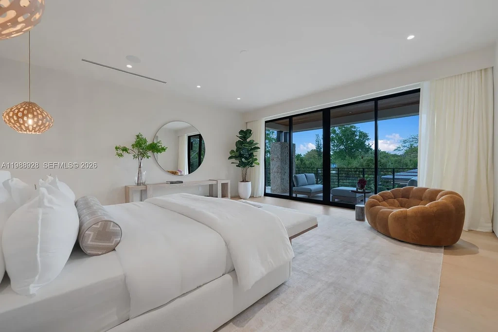 A $22 Million Tropical Modern Estate Brings Resort-Style Living to Miami’s Prestigious Ponce Davis 13 Luxury tropical modern estate in Miami with private tennis court, pool, and expansive outdoor living spaces at sunset