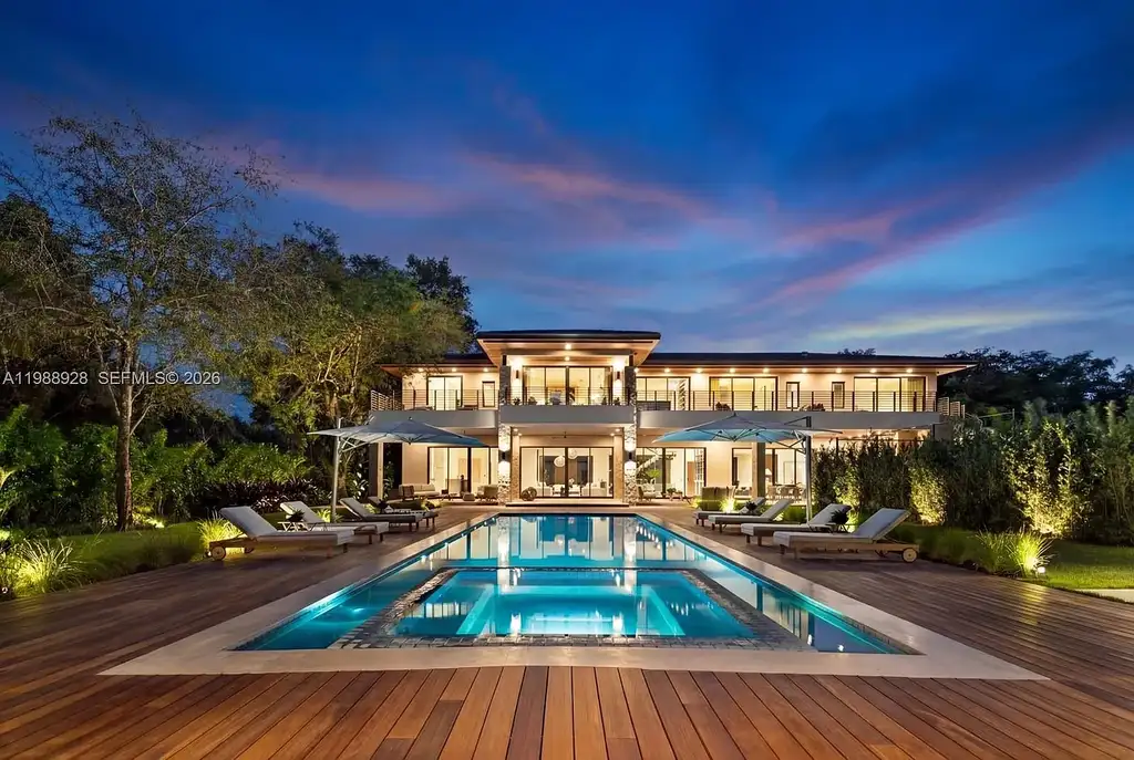 A $22 Million Tropical Modern Estate Brings Resort-Style Living to Miami’s Prestigious Ponce Davis 18 Luxury tropical modern estate in Miami with private tennis court, pool, and expansive outdoor living spaces at sunset