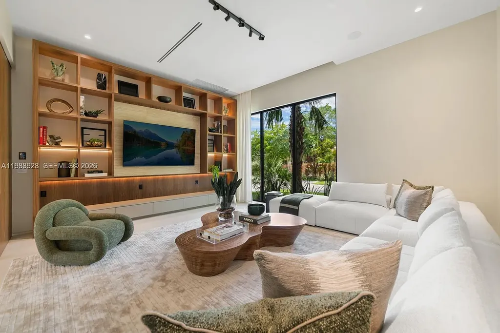 A $22 Million Tropical Modern Estate Brings Resort-Style Living to Miami’s Prestigious Ponce Davis 7 Luxury tropical modern estate in Miami with private tennis court, pool, and expansive outdoor living spaces at sunset