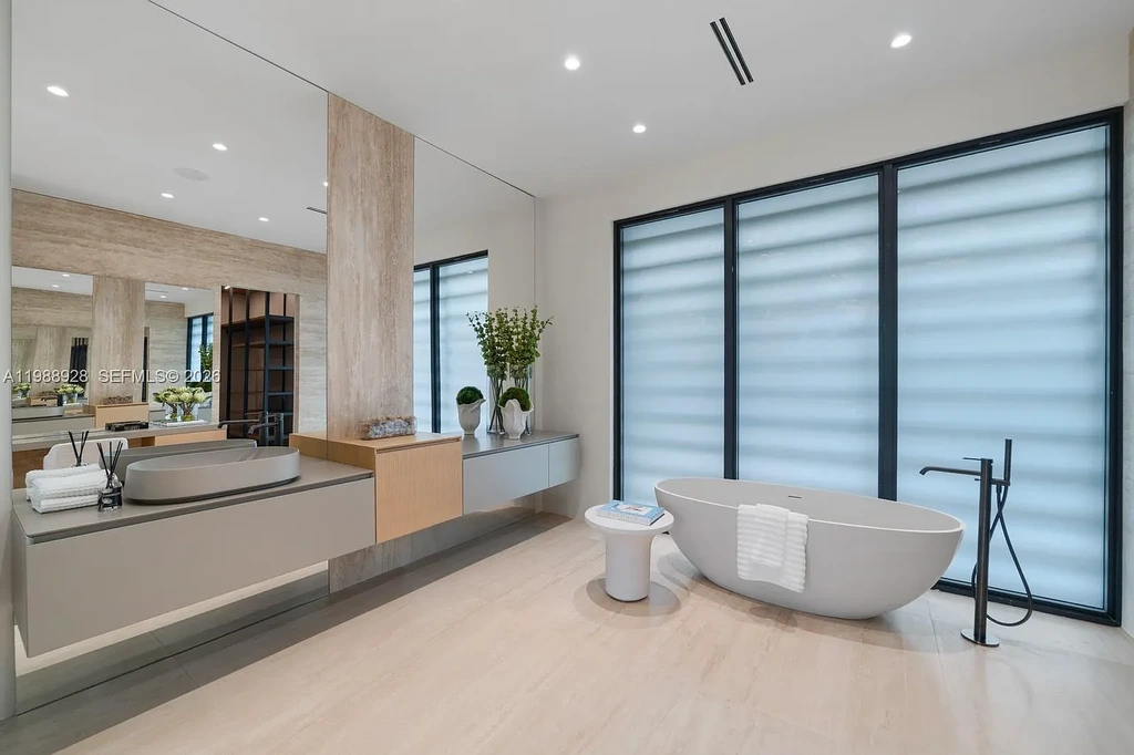 A $22 Million Tropical Modern Estate Brings Resort-Style Living to Miami’s Prestigious Ponce Davis 15 Luxury tropical modern estate in Miami with private tennis court, pool, and expansive outdoor living spaces at sunset