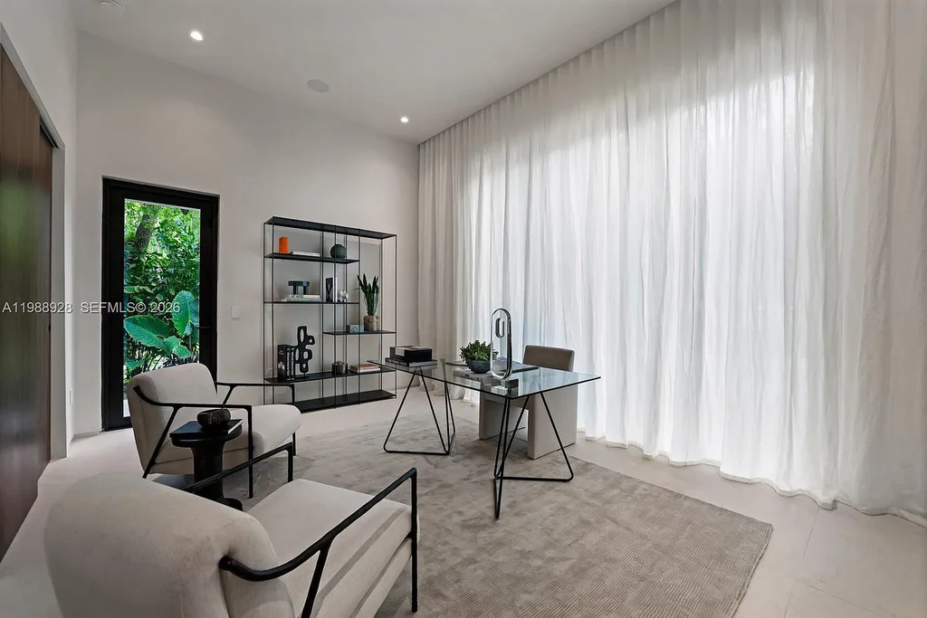 A $22 Million Tropical Modern Estate Brings Resort-Style Living to Miami’s Prestigious Ponce Davis 14 Luxury tropical modern estate in Miami with private tennis court, pool, and expansive outdoor living spaces at sunset