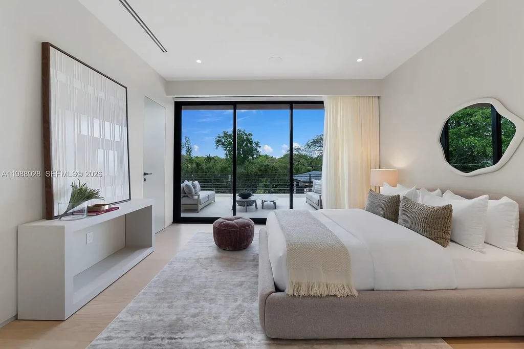 A $22 Million Tropical Modern Estate Brings Resort-Style Living to Miami’s Prestigious Ponce Davis 16 Luxury tropical modern estate in Miami with private tennis court, pool, and expansive outdoor living spaces at sunset