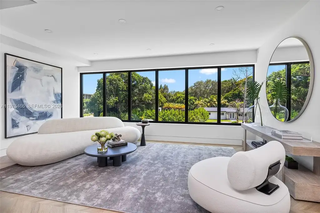 $10.4 Million Spectacular Modern Estate Redefining Luxury Living in Prime Pinecrest Real Estate 13 Chef’s kitchen with premium appliances and oversized island at 6445 SW 129th Ter Pinecrest