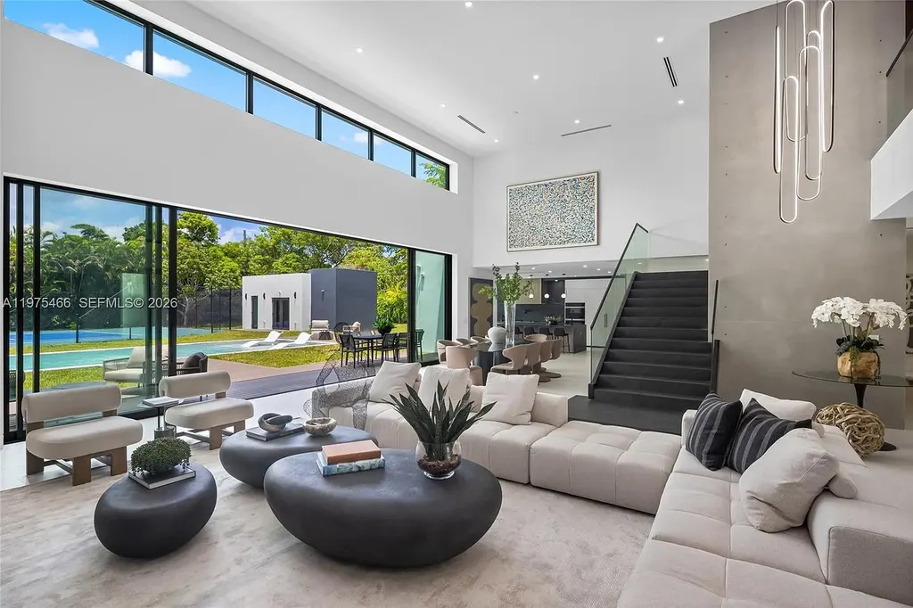 $10.4 Million Spectacular Modern Estate Redefining Luxury Living in Prime Pinecrest Real Estate 6 Chef’s kitchen with premium appliances and oversized island at 6445 SW 129th Ter Pinecrest