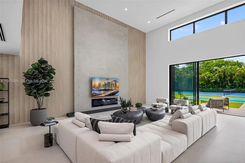 $10.4 Million Spectacular Modern Estate Redefining Luxury Living in Prime Pinecrest Real Estate 7 Chef’s kitchen with premium appliances and oversized island at 6445 SW 129th Ter Pinecrest