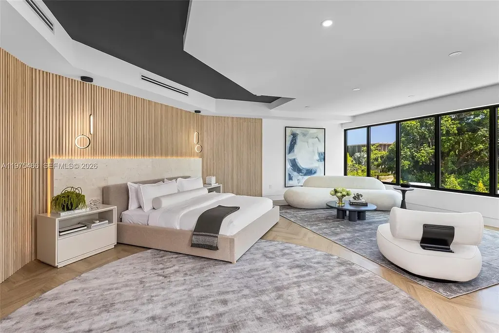 $10.4 Million Spectacular Modern Estate Redefining Luxury Living in Prime Pinecrest Real Estate 12 Chef’s kitchen with premium appliances and oversized island at 6445 SW 129th Ter Pinecrest