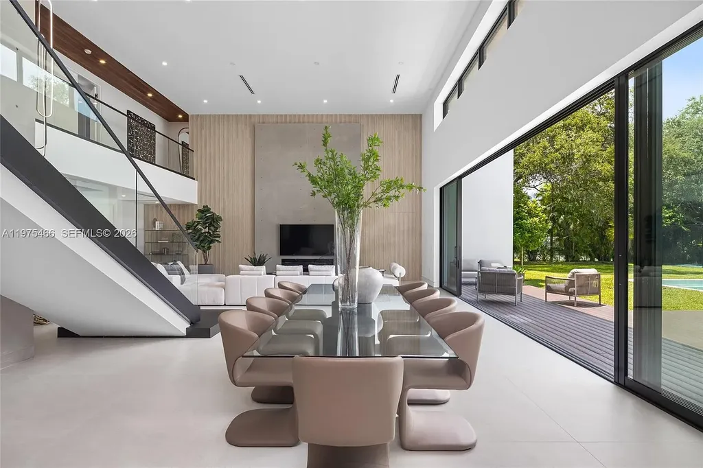 $10.4 Million Spectacular Modern Estate Redefining Luxury Living in Prime Pinecrest Real Estate 9 Chef’s kitchen with premium appliances and oversized island at 6445 SW 129th Ter Pinecrest