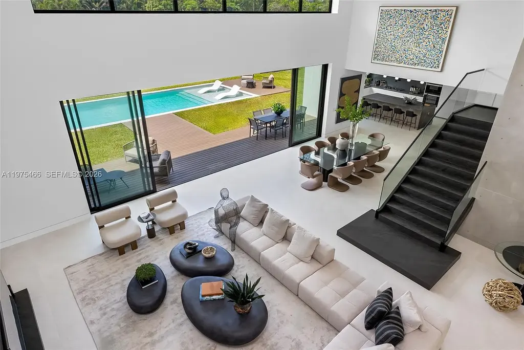 $10.4 Million Spectacular Modern Estate Redefining Luxury Living in Prime Pinecrest Real Estate 10 Chef’s kitchen with premium appliances and oversized island at 6445 SW 129th Ter Pinecrest