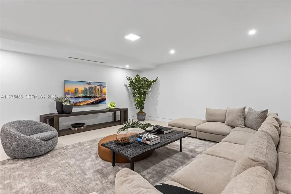 $10.4 Million Spectacular Modern Estate Redefining Luxury Living in Prime Pinecrest Real Estate 15 Chef’s kitchen with premium appliances and oversized island at 6445 SW 129th Ter Pinecrest